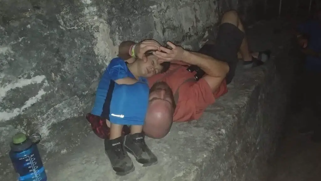 Tikal Sunrise Tour - Chad and Eli sleeping on a step of Temple IV