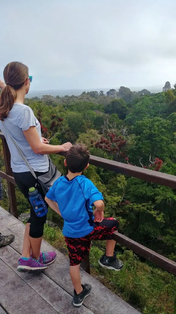 Diane and Eli looking at the View from the top of Temple III Tikal