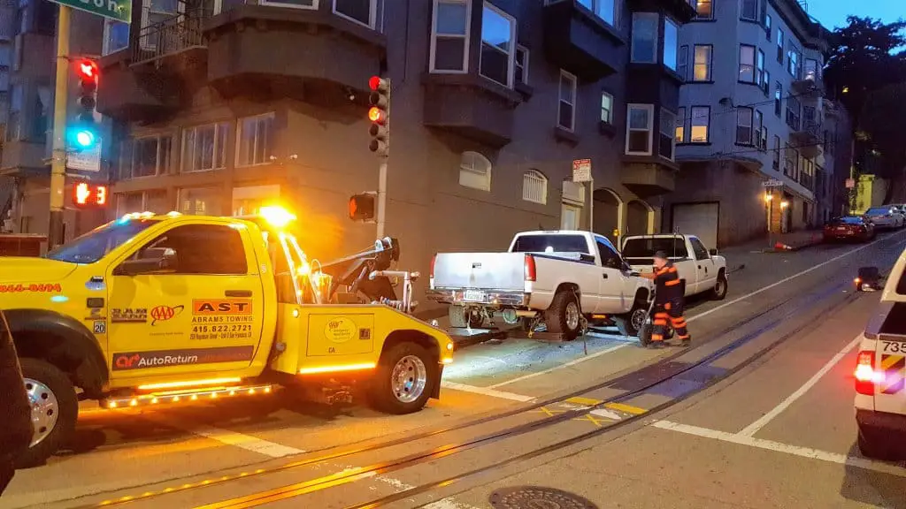 Tow Truck towing a truck that was blocking the cable car route