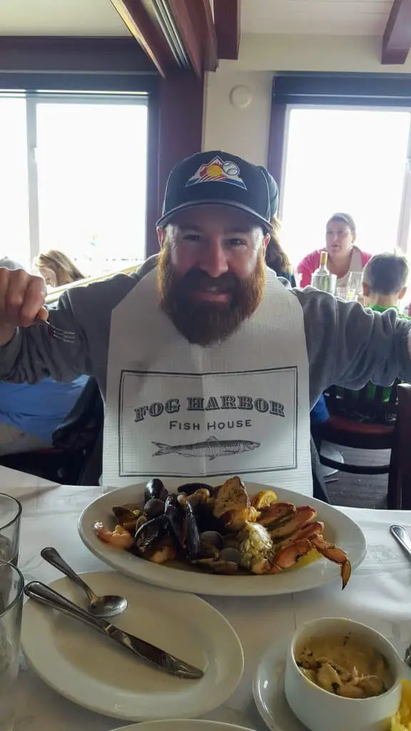 Chad digging in to a plate of shellfish at Fog Harbor Fish House in Fishermans Wharf