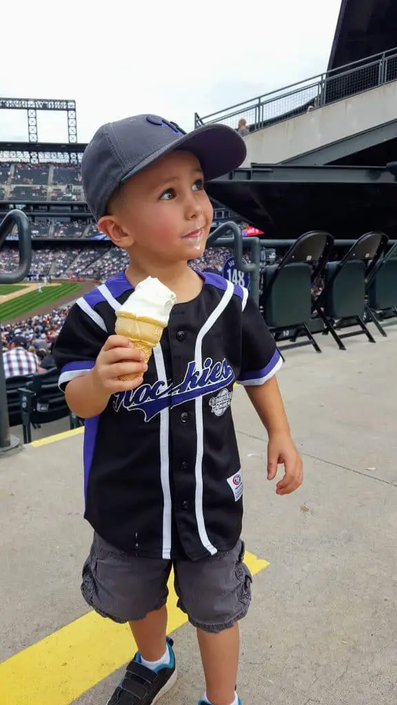 Eli eating a soft-serve ice cream cone at a rockies game