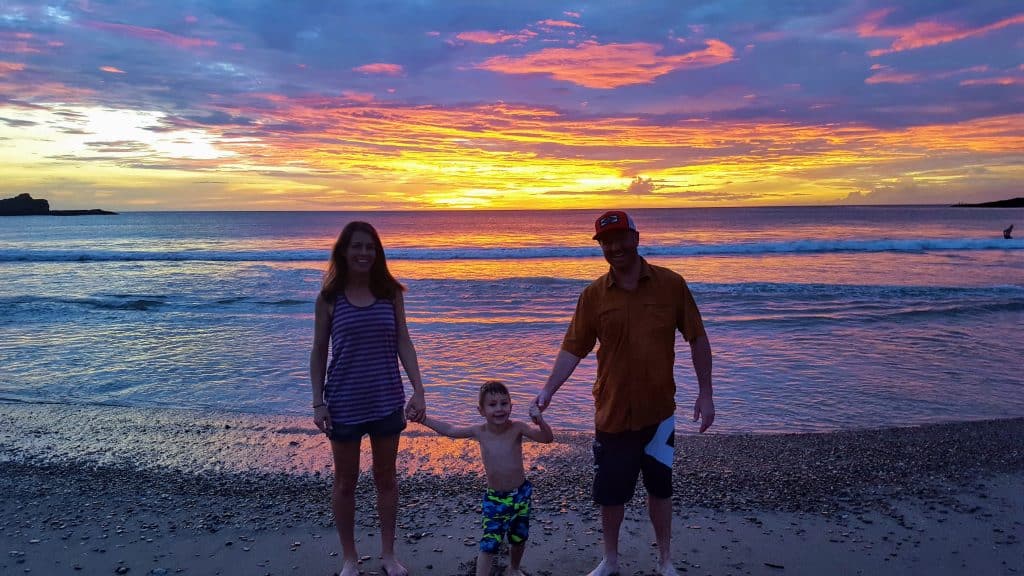 Family on Playa Marsella beach in front of a beautiful sunset