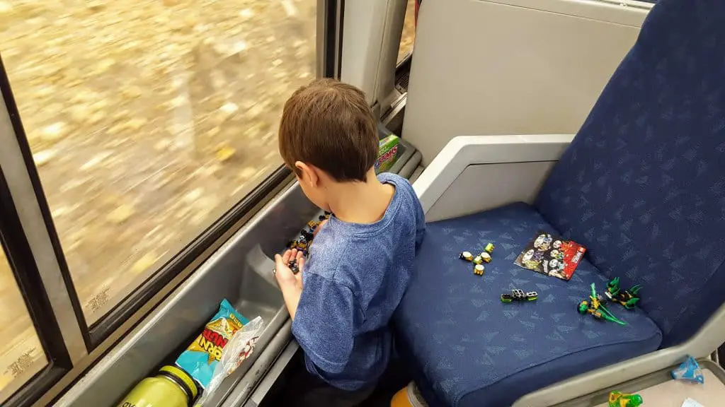 Eli playing with toys while riding the amtrak train