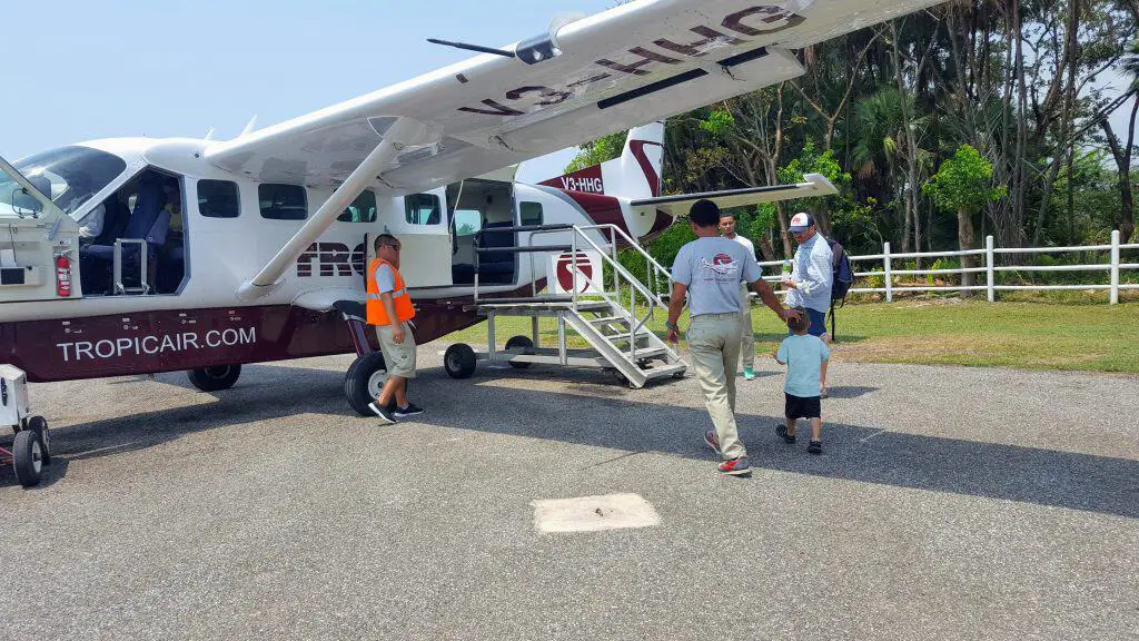 People getting on a small plane in Placencia Belize