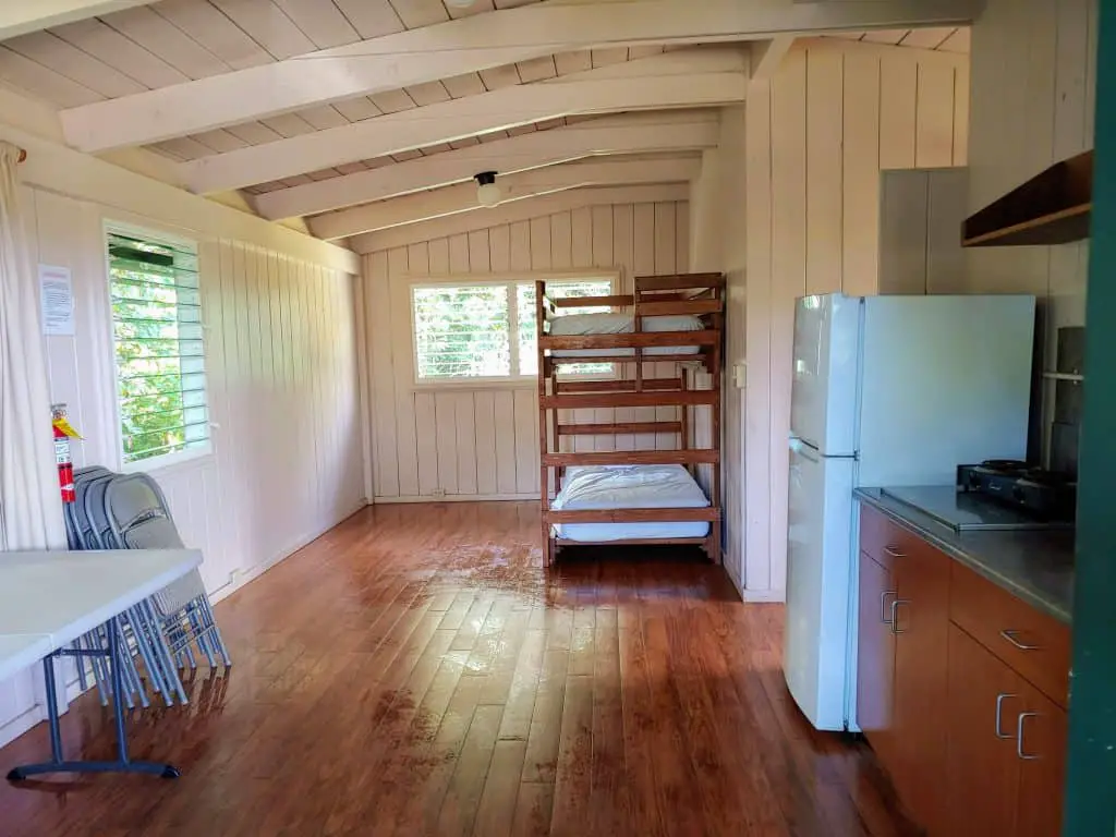 Main room with bunk beds at a Wai'anapanapa state park cabin in Maui, Hawaii