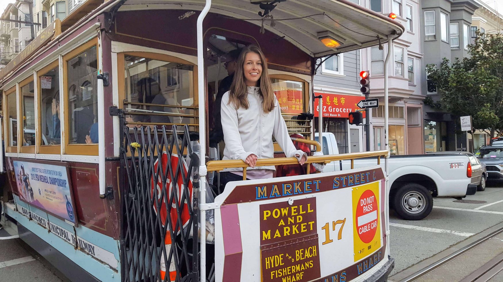 Diane on the back of a cable car in San Francisco