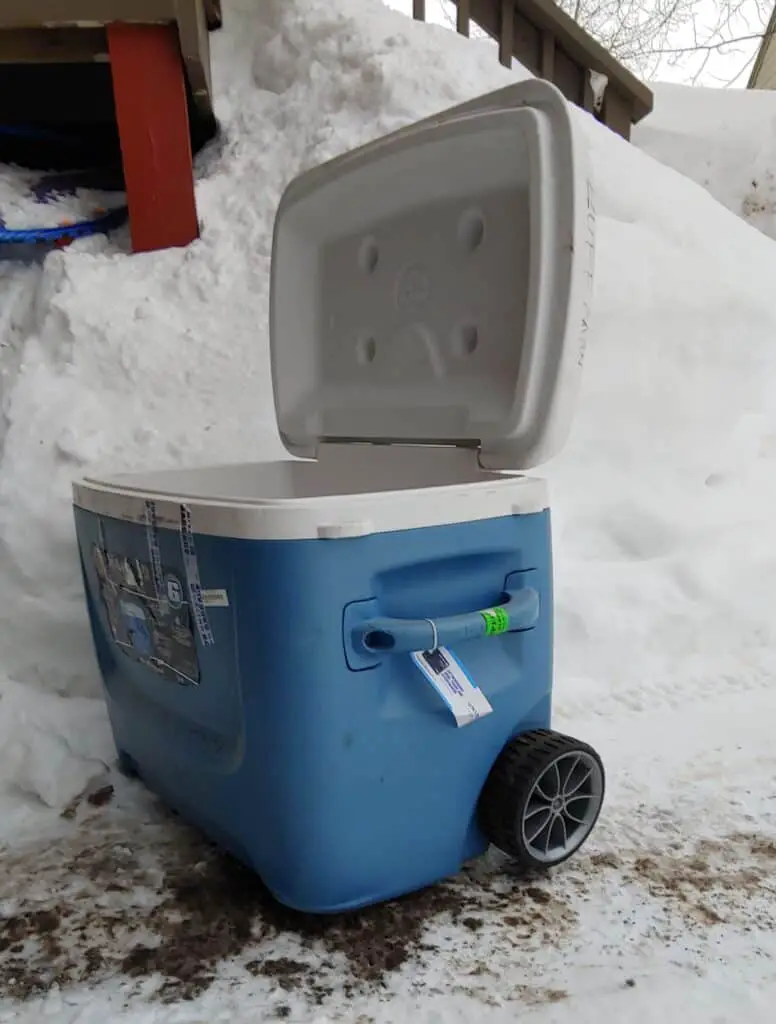 Open Cooler on wheels outside in the snow