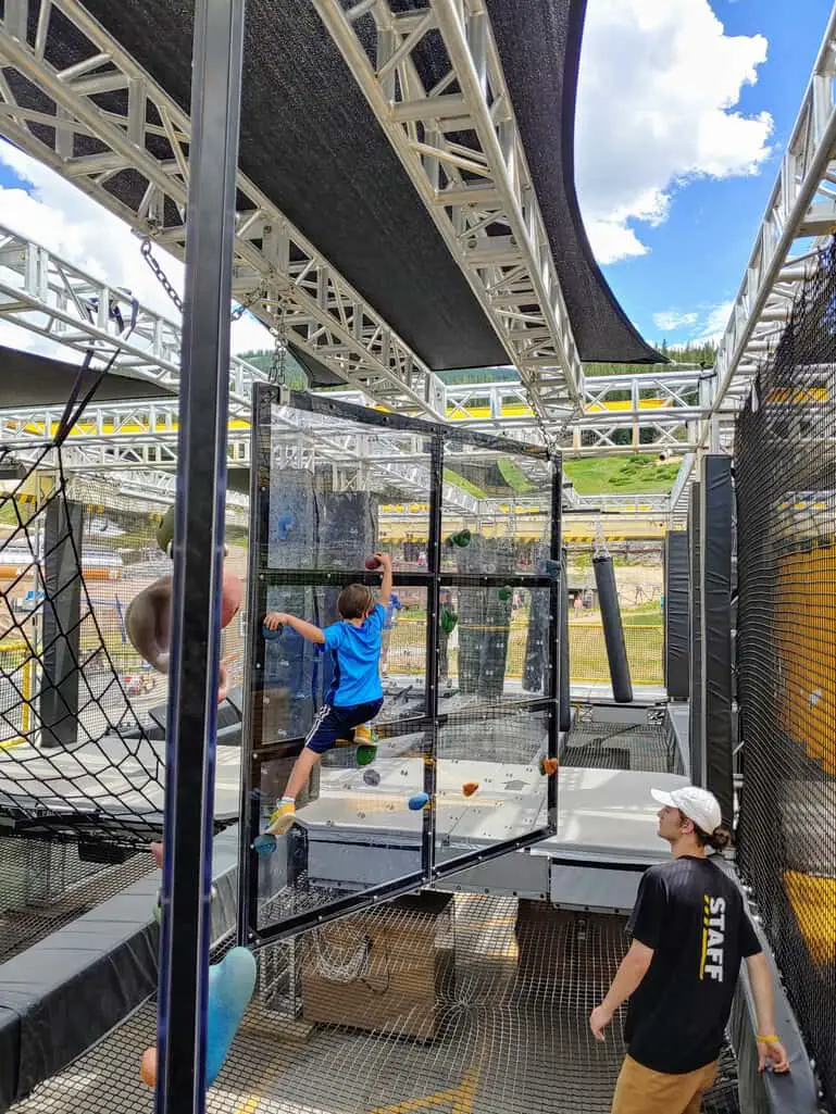 Summer in Copper Mountain - Eli on the climbing wall inside the Wrecktangle
