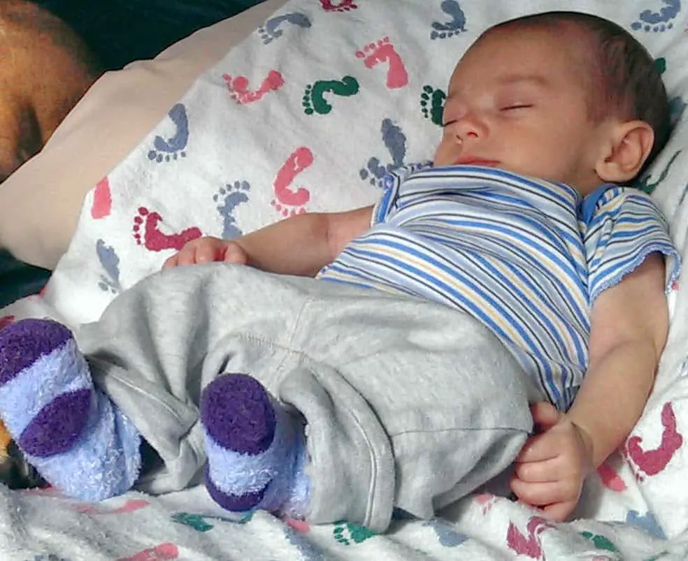 Infant sleeping on a blanket