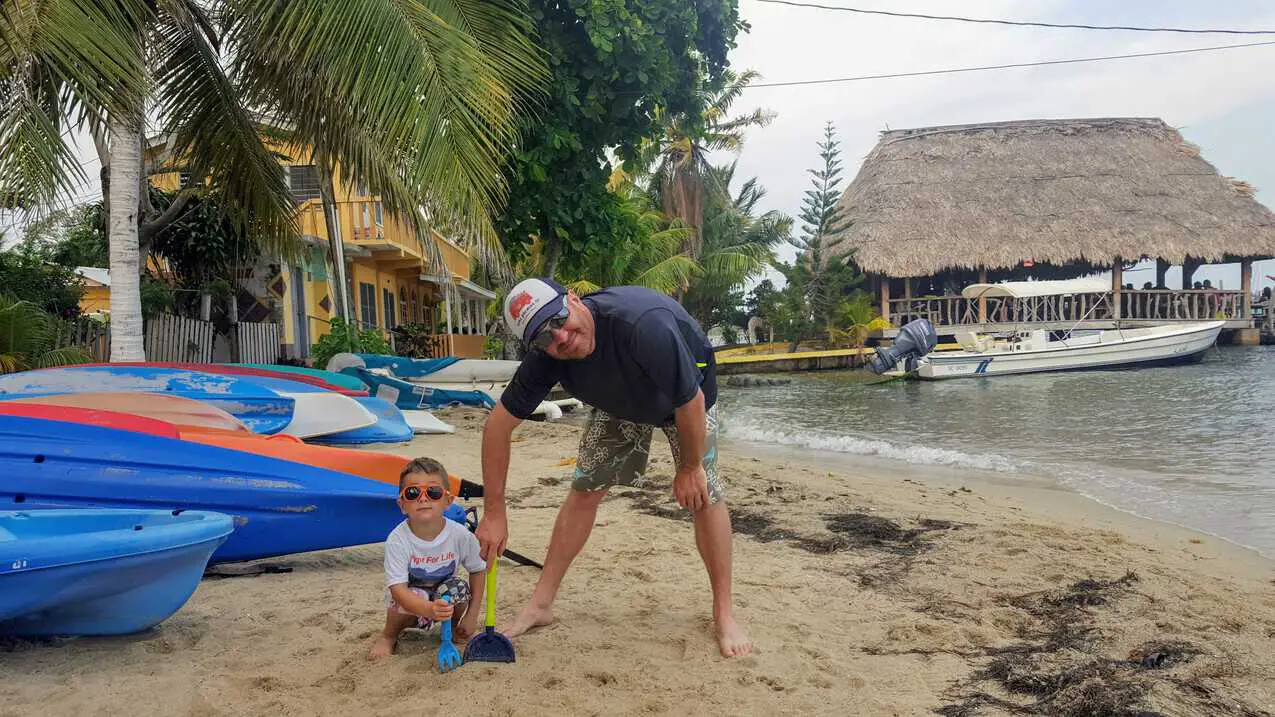 Father and son on the beach in Placencia, Belize