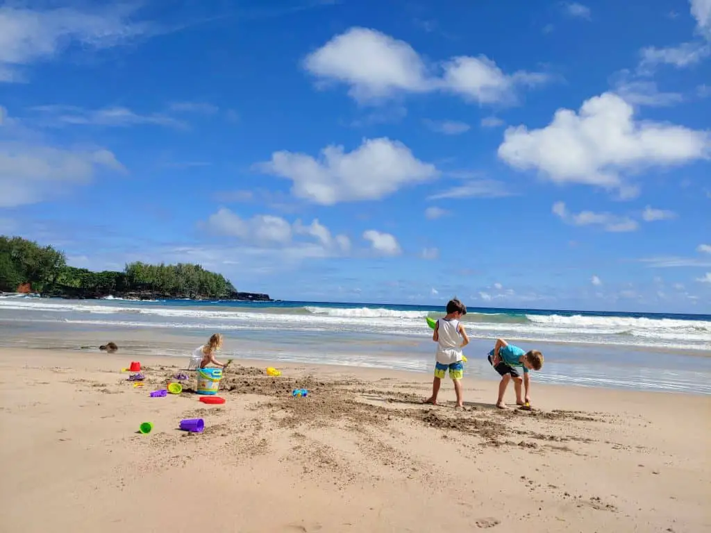 Kids playing on a beach in Hawaii