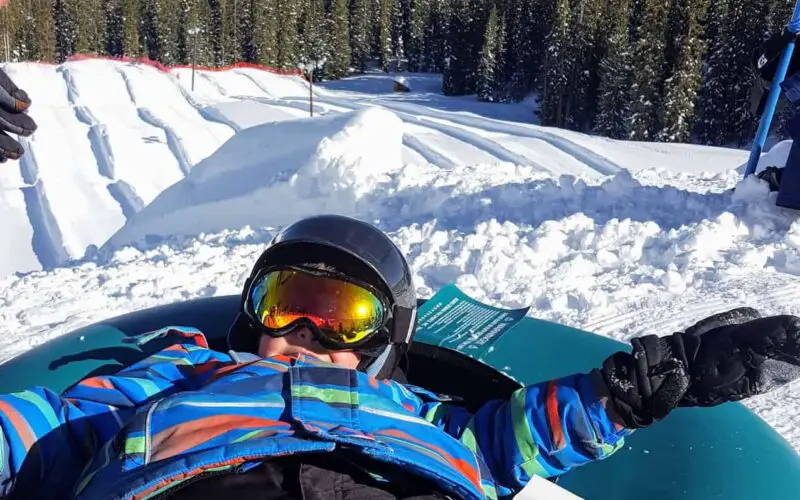 boy at the top of the tubing hill in keystone