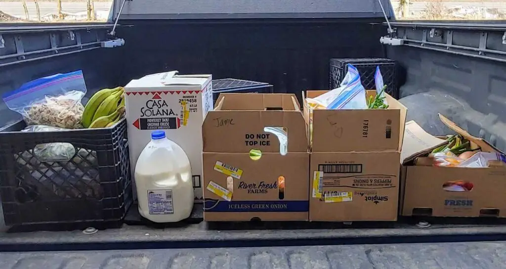 Food in boxes in the back of a truck