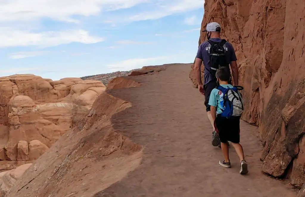 Father and son on Delicate Arch Trail