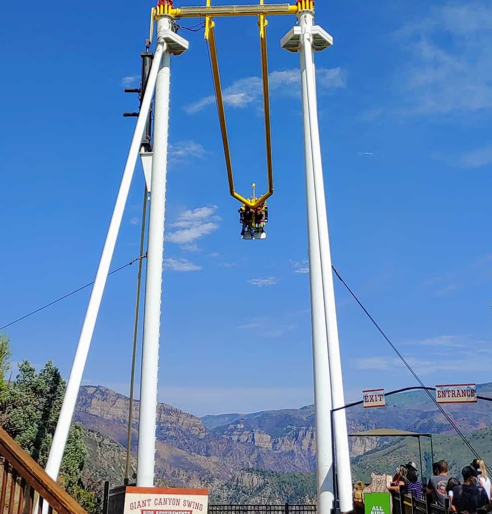 Gigantic swing at Glenwood Adventure Park in Glenwood Springs Colorado in the summer