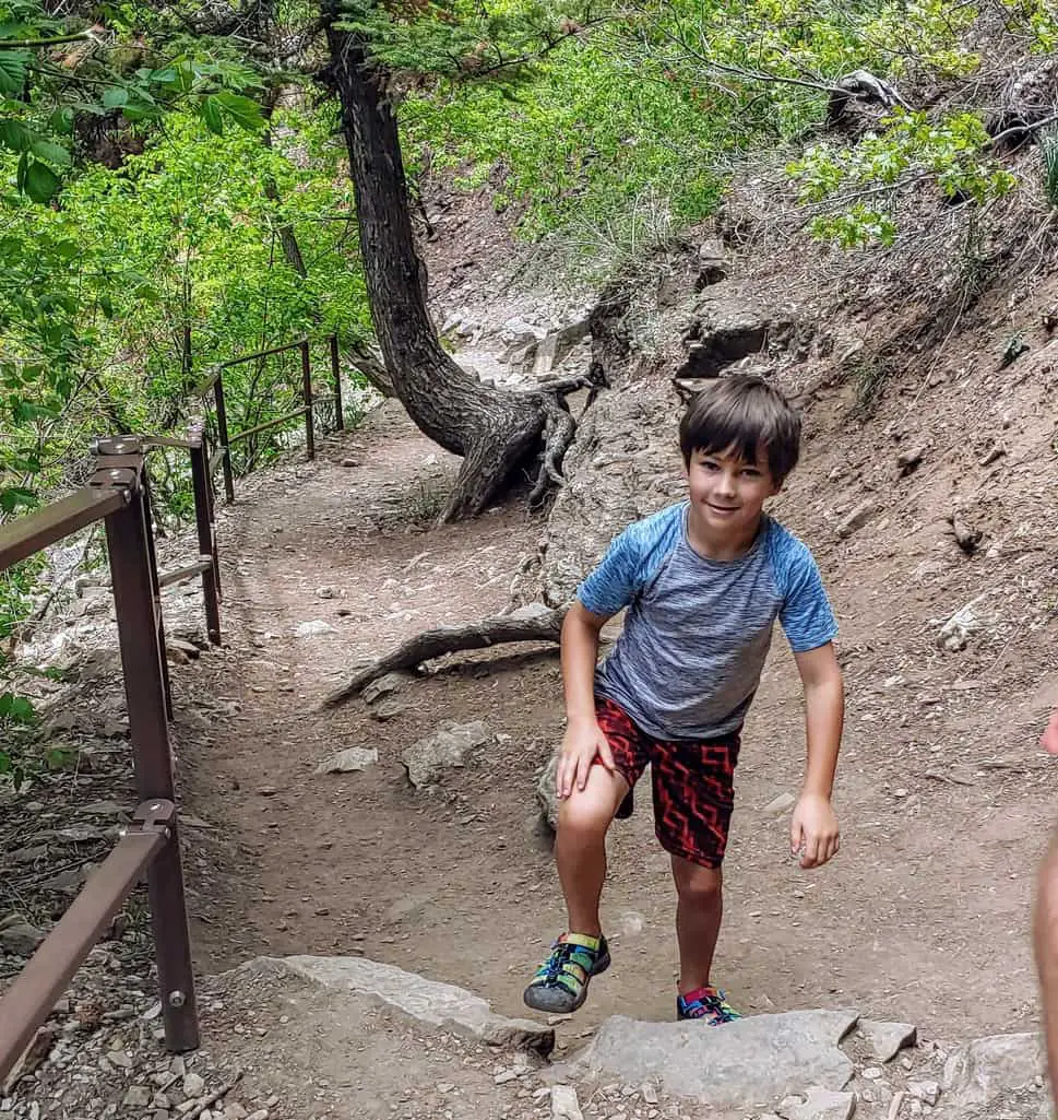 boy hiking the trail to Hanging Lake near Glenwood Springs, Colorado