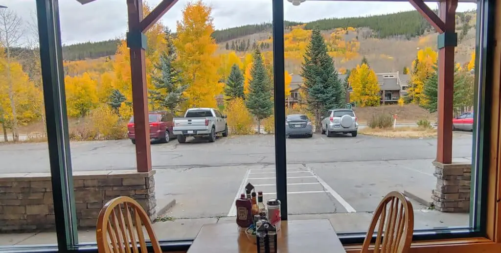 table at the Haywood Cafe in Keystone with yellow aspens as the view