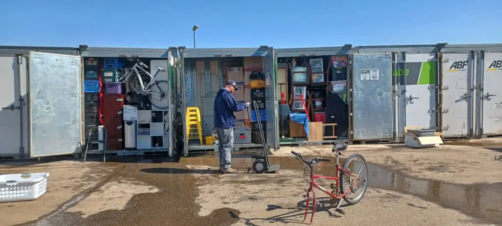 man loading up containers full of household goods