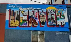 Sign painted on the side of a building that says DENVER