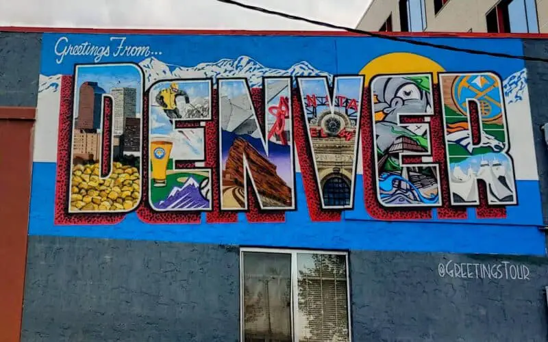 Sign painted on the side of a building that says DENVER