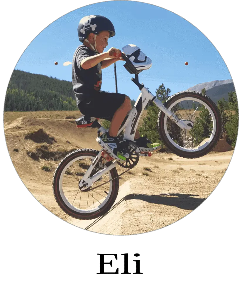 Eli going off a jump on his bike